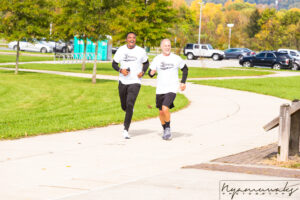 Two men running at Glasgow park